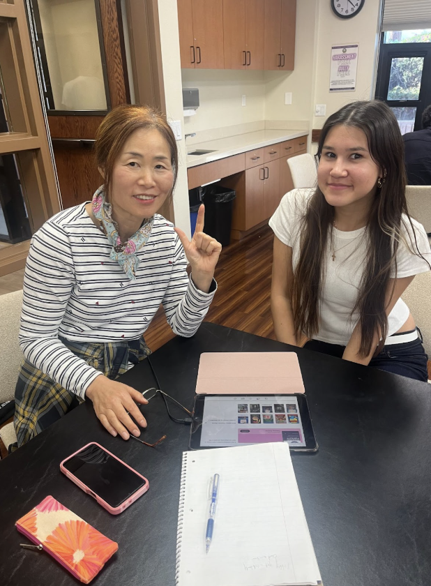 Senior and student working together